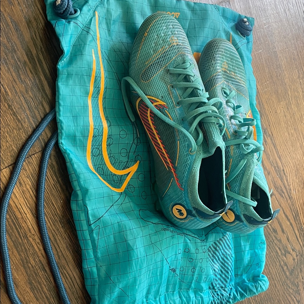 Nike Teal Sneakers with Orange Highlights